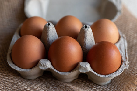 Chicken eggs in an egg carton. Homemade chicken eggs close-up. Easter eggs. High quality photoの写真素材