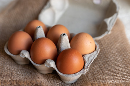 Chicken eggs in an egg carton. Homemade chicken eggs close-up. Easter eggs. High quality photoの写真素材