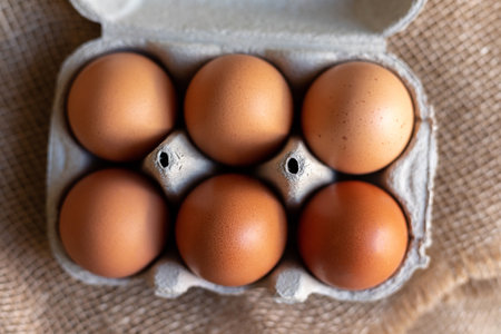 Chicken eggs in an egg carton. Homemade chicken eggs close-up. High quality photoの写真素材