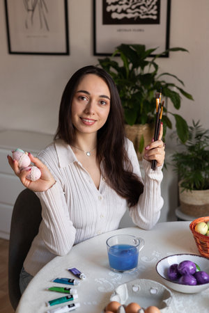 Beautiful young woman holding easter eggs in her hands. Preparing for Easter. High quality photoの写真素材