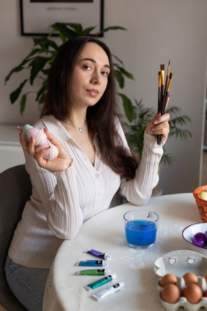 Beautiful young woman holding easter eggs in her hands. Preparing for Easter. High quality photoの写真素材