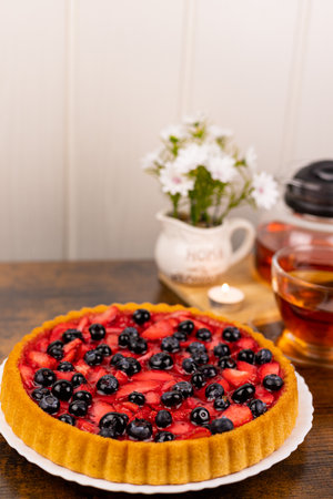 Berry pie and tea on the table. Dessert for tea. Berry pie. Strawberry pie on the table. High quality photoの写真素材