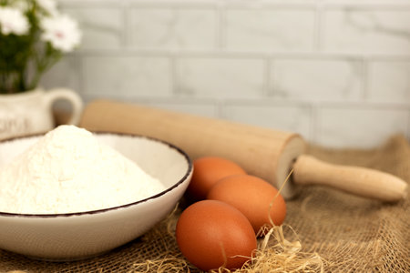 Baking products - flour, eggs. Flour and eggs on the table close-up. High quality photoの写真素材