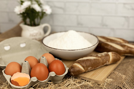 Freshly baked bread, flour, eggs. The process of baking bread. Baking Ingredients. High quality photoの写真素材