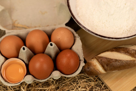 Freshly baked bread, flour, eggs. The process of baking bread. Baking Ingredients. High quality photoの写真素材