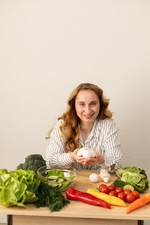 A woman holds mushrooms in her hands. A woman cooks a dish of mushrooms. High quality photoの写真素材