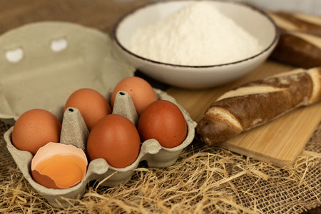 Freshly baked bread, flour, eggs. The process of baking bread. Baking Ingredients. High quality photoの写真素材
