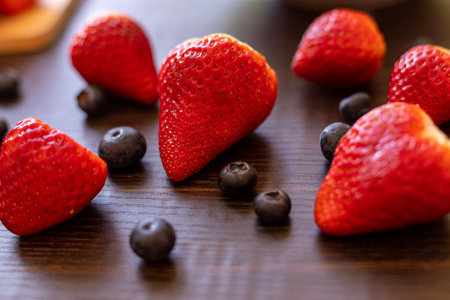 Berries on a wooden background. Strawberries and blueberries. Top view. High quality photoの写真素材