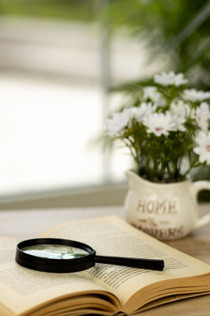 A book with a magnifying glass. High quality photoの写真素材