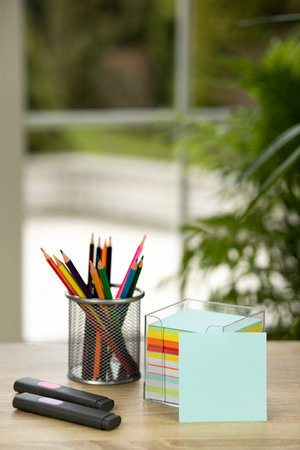 Colored pencils in a stand. Stationery in the office. High quality photoの写真素材
