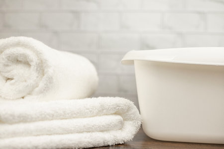 White terry towel. Cotton towel. White basin. Bathroom. High quality photoの写真素材