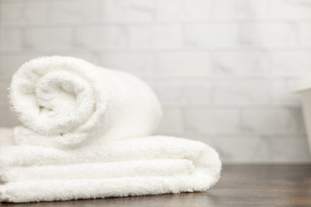 White terry towels. Folded white towel. Towel on the shelf. High quality photoの写真素材