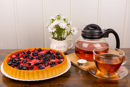 Berry pie and tea on the table. Dessert for tea. Berry pie. Strawberry pie on the table. High quality photoの写真素材
