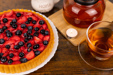 Berry pie and tea on the table. Dessert for tea. Berry pie. Strawberry pie on the table. High quality photoの写真素材