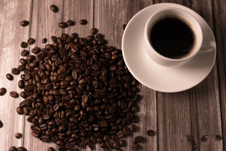 Coffee beans view from above. A cup of espresso coffee. Aromatic coffee. High quality photoの写真素材