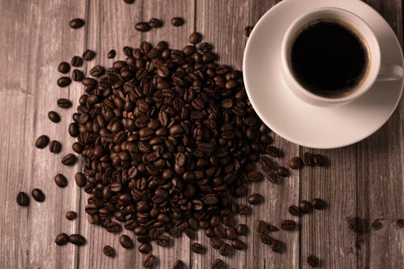 Coffee background. Coffee on top. Coffee beans and a cup of espresso. High quality photoの写真素材