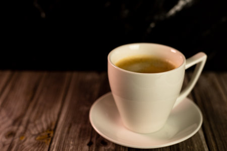 A cup of coffee on the table. Coffee in a cup. Coffee with foam. High quality photoの写真素材
