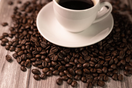 A cup of espresso coffee. A cup of coffee stands on coffee beans. Decaffeinated coffee. High quality photoの写真素材