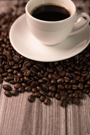 Aromatic coffee in a white cup. Esresso cup on a wooden table. High quality photoの写真素材