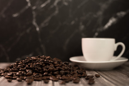 Arabica coffee beans, a cup of espresso coffee. Coffee advertising. High quality photoの写真素材
