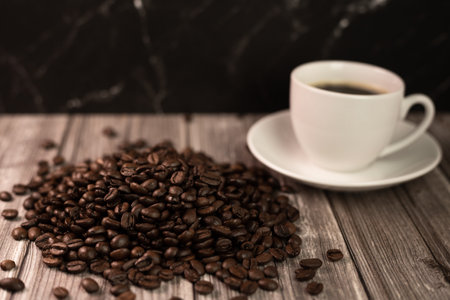 Arabica coffee beans, a cup of espresso coffee. Coffee advertising. High quality photoの写真素材