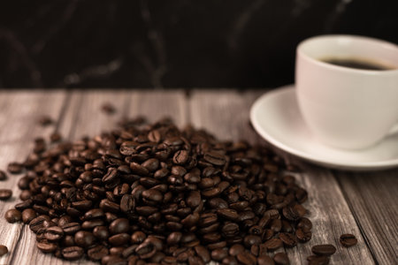 Espresso coffee and coffee beans on the table. Coffee in a white cup. High quality photoの写真素材