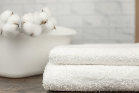 White terry towels. A white plastic basin. High quality photoの写真素材