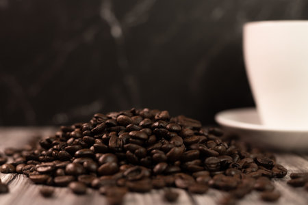 Grains of fire Arabica. Coffee beans on a wooden table. Roasted coffee. High quality photoの写真素材