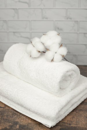Cotton flowers lie on towels. Natural cotton. High quality photoの写真素材