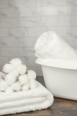 White terry towel. Cotton towel. White basin. Bathroom. High quality photoの写真素材
