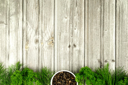 Herbs and black pepper on the table. View from above. Dill, parsley and peppercorns. Recipe for cooking. High quality photoの写真素材