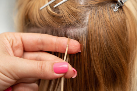 Professional Hair Extension Technique in Beauty Salonの写真素材