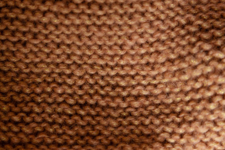 Knitted wool fabric texture in warm brown color. High quality photoの写真素材