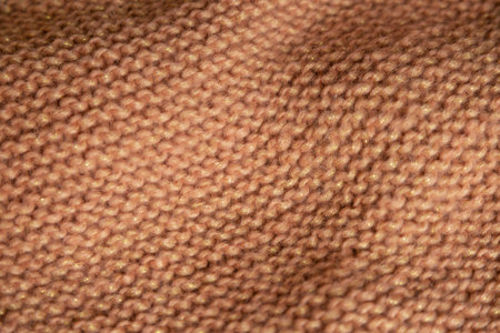 Brown canvas knitted with knitting needles. View from above. Knitted things. High quality photoの写真素材