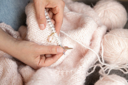 Cozy handmade knitting with wool yarn and needles representing comfort creativity and home hobbyの写真素材