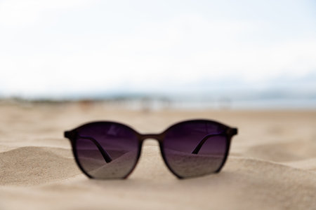 Travel and tourism concept sunglasses by the sea. High quality photo