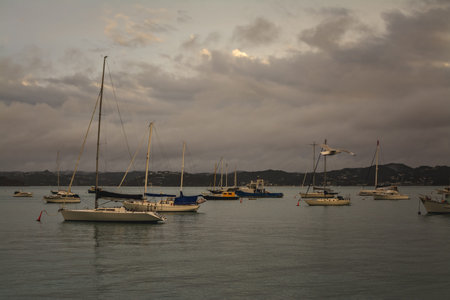 Vintage photo of small pleasure boats waiting out stormy weather in a small harbour