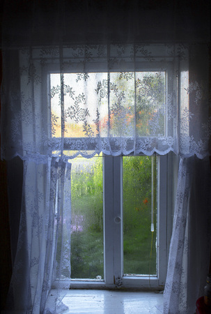 Old window in a village house in Russiaの写真素材