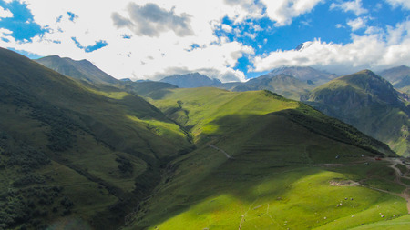 Mountain kazbek. Caucasus mountains. Beauty world. Cloudy morning view of the mountain hill in Upper Svanetia, Georgia, Europe.の写真素材