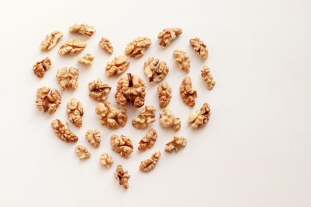 Heart in the form of nuts.Healthy walnuts for health. View from flat layの写真素材