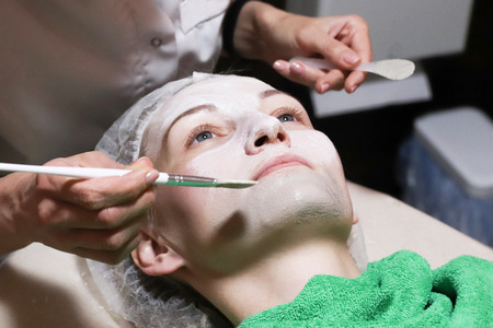 Face skin care. Spa skin and body care. Close-up of young womanの写真素材