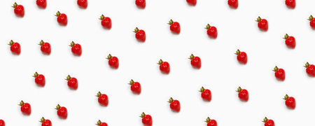 Beautiful pattern with red fresh strawberries. Strawberries on a pink background.