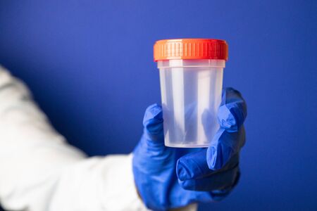 Medical urine test cup to hold patient dope testing anti drugs, sampleの写真素材