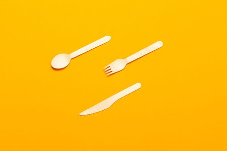 Ecological disposable tableware on an orange background. zero ecologyの写真素材