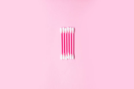 Composition of plastic wool swabs in the background. Flat lay. Copy space Trend concept....