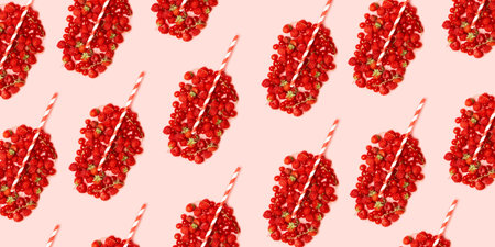 Summer fruit concept pattern. Different red ripe berries in the shape of a glass with fruit juice...