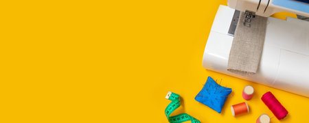 Composition with threads and sewing accessories on color background, flat lay