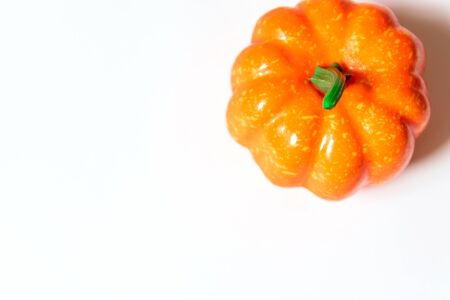 Autumn composition, halloween concept. Pumpkin on orange background. Empty space for your text.の写真素材