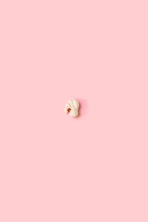 Popcorn isolated on pink background with clipping path. Flat layの写真素材