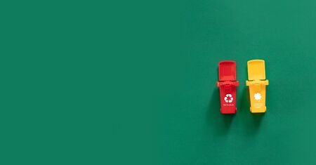 Trash bins and different garbage. Concept of environmental pollution by plastic waste.の写真素材